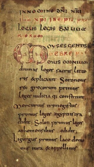An ancient manuscript with text and a decorative initial. 2