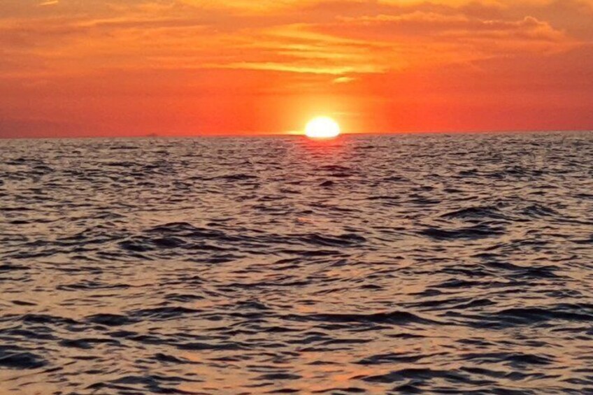 A sunset over the ocean with waves. 3