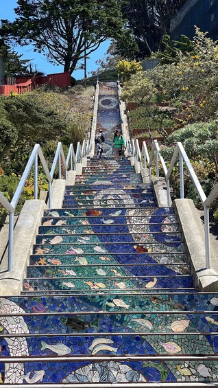 A staircase with mosaic tiles depicting fish and sea creatures. 2