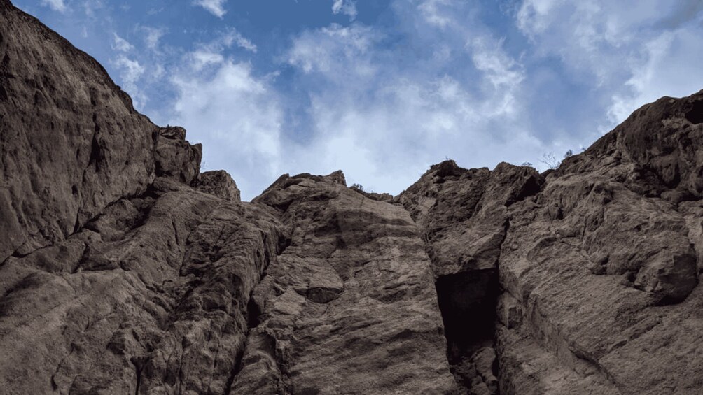 A rugged canyon with a narrow opening. 4