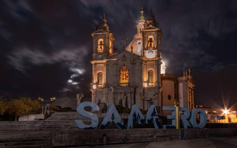 A lit-up church at night with 'SAMERO' in the foreground. 2