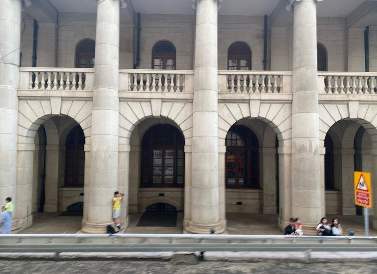 A classical building with large columns and arched windows. 1