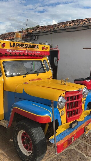 A colorful vintage truck with 'LA PRESUMIDA' and 'Rutas de Turismo - Barichara - Guane' on its side. 5