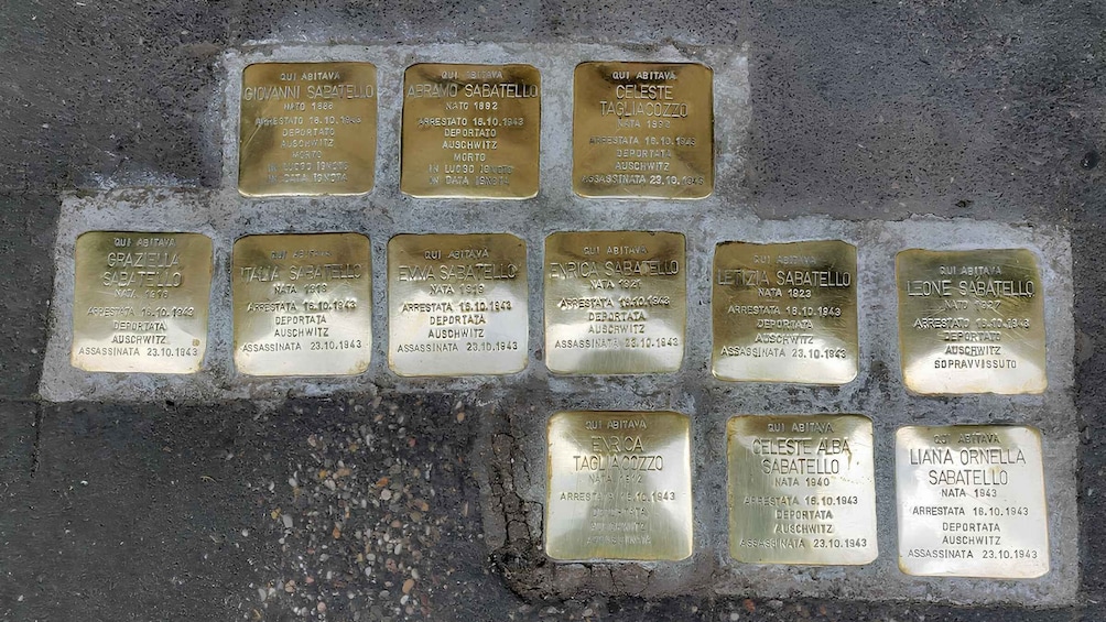 A collection of commemorative plaques on a wall. 2