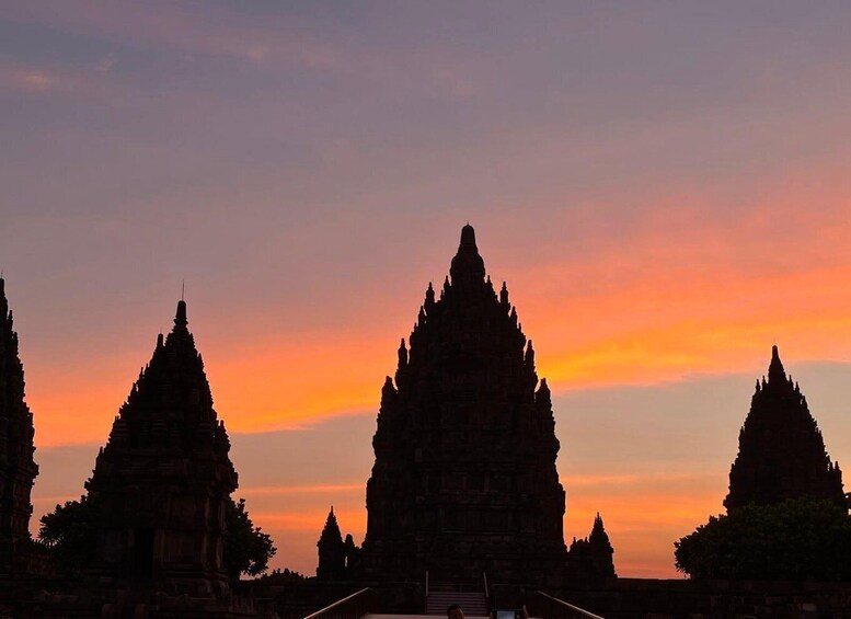 A temple complex at sunset with multiple tiered structures. 5