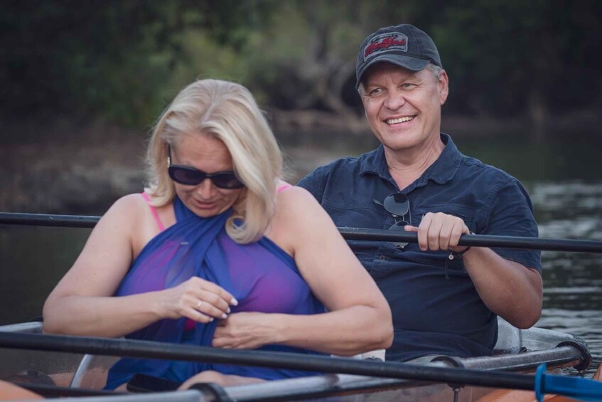 Two people on a boat in a body of water. 3