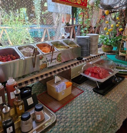A buffet with various food items and condiments. 3