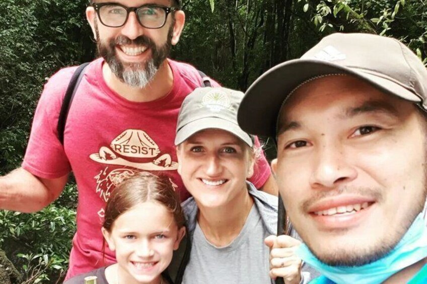 A group of people in a forested area. 2