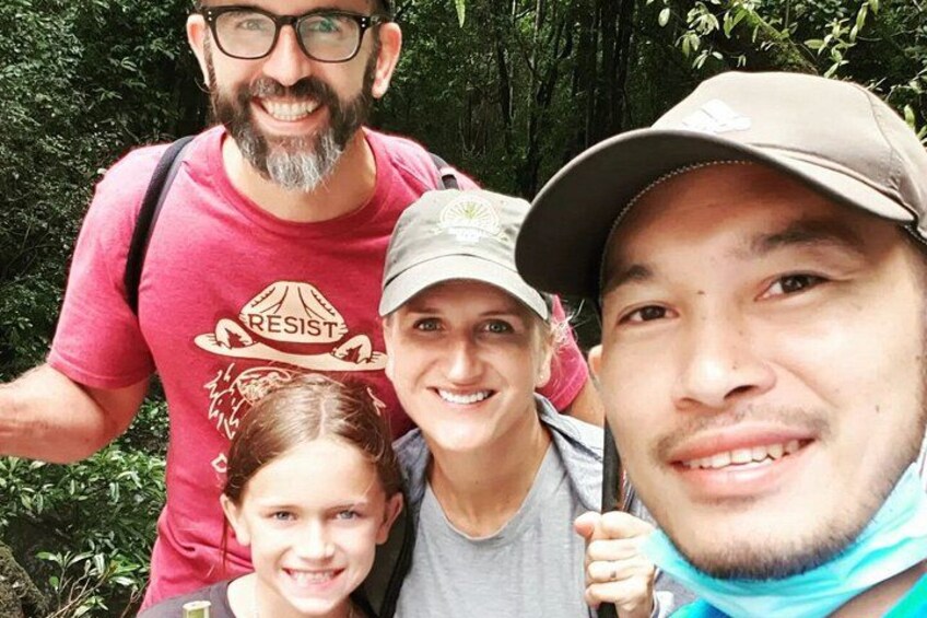 A group of people in a forested area. 2
