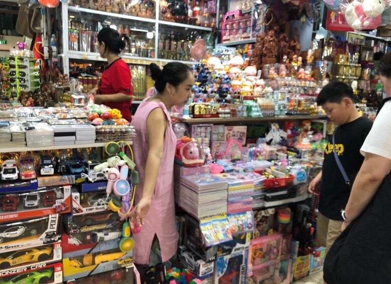 A toy store with shelves of toys and games, including boxed cars and action figures. 3