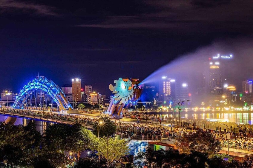 A nighttime cityscape with illuminated bridges and a large dragon sculpture. 5