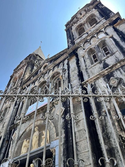 A historic cathedral with intricate ironwork and statues. 4