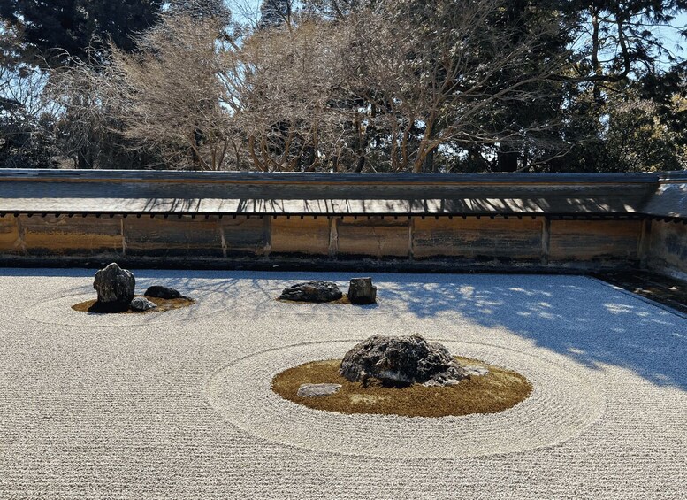 A Zen garden with rocks and gravel. 4