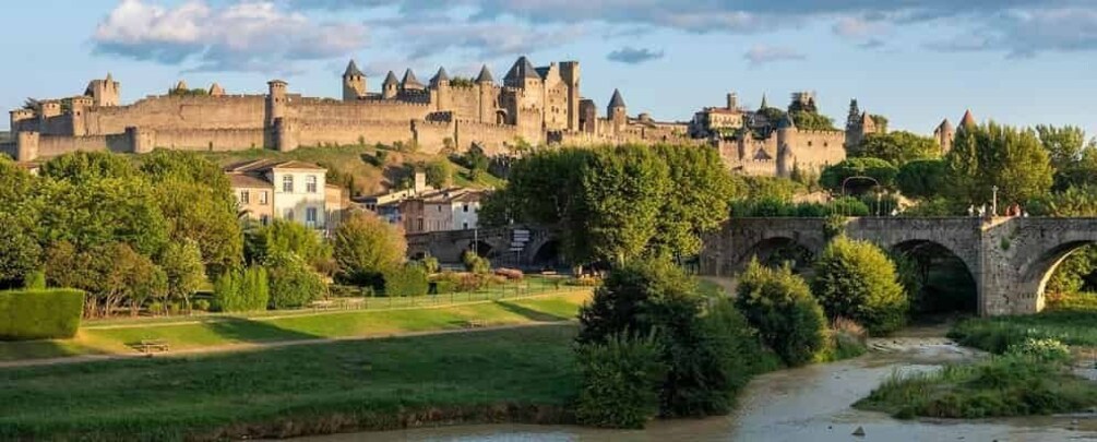 A medieval castle, a river, and a stone bridge. 1