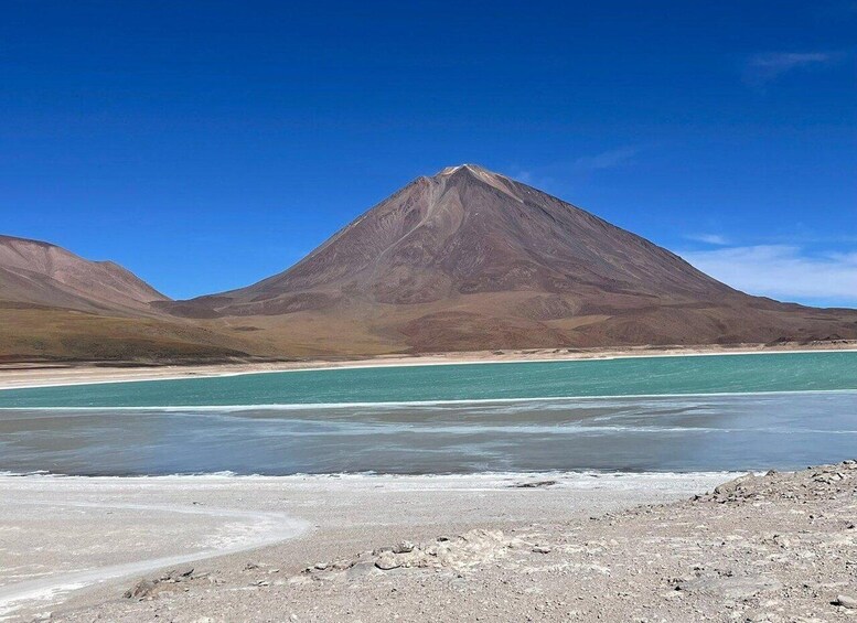 A mountain, a lake, and a desert landscape. 3