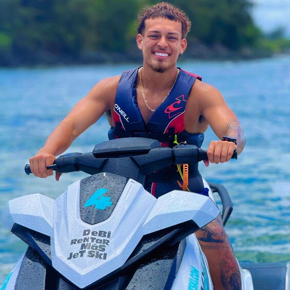 A person riding a jet ski on water. 5