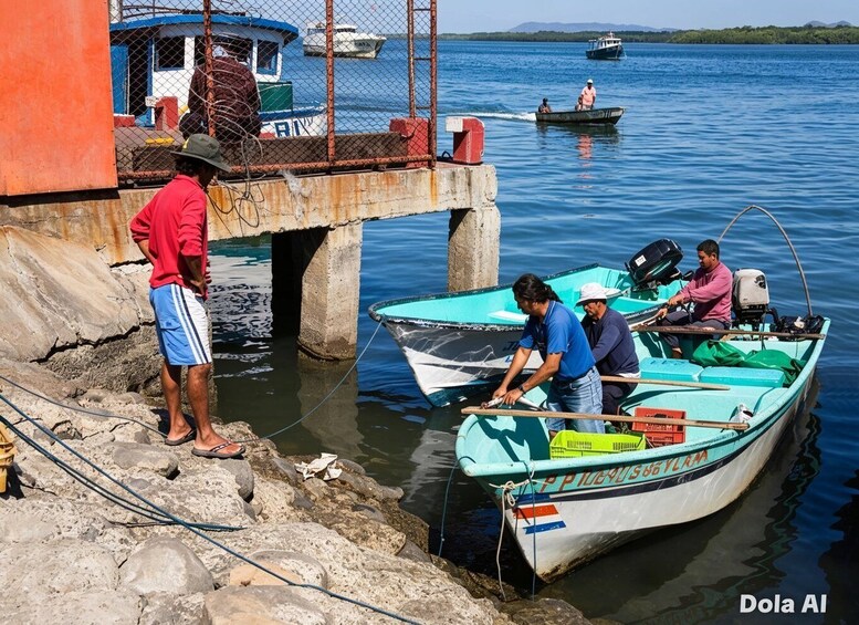 A dock with boats, a man in a red shirt, and a rocky shoreline. 4