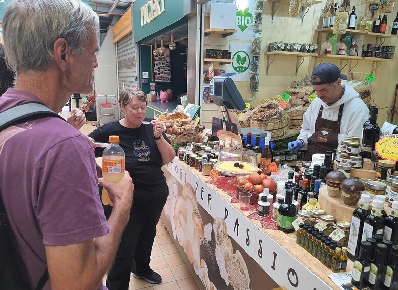 A market stall with various food items and a sign that reads 'Passion.' 5