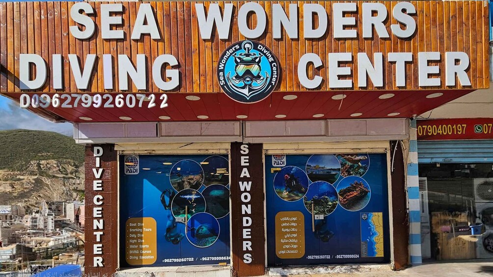 A diving center named 'Sea Wonders Diving Center' with contact numbers and a logo. 4
