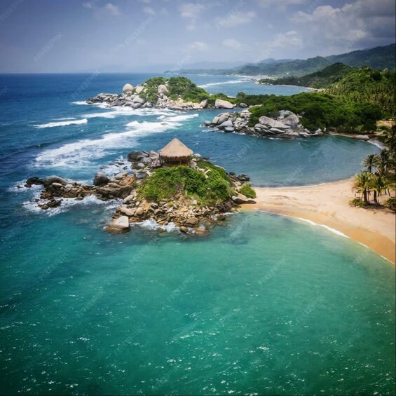 A tropical beach with clear turquoise waters, a small island with a thatched hut, and lush green hills in the background. 1