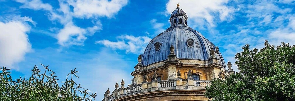 A large dome structure with a clear blue sky in the background. 5