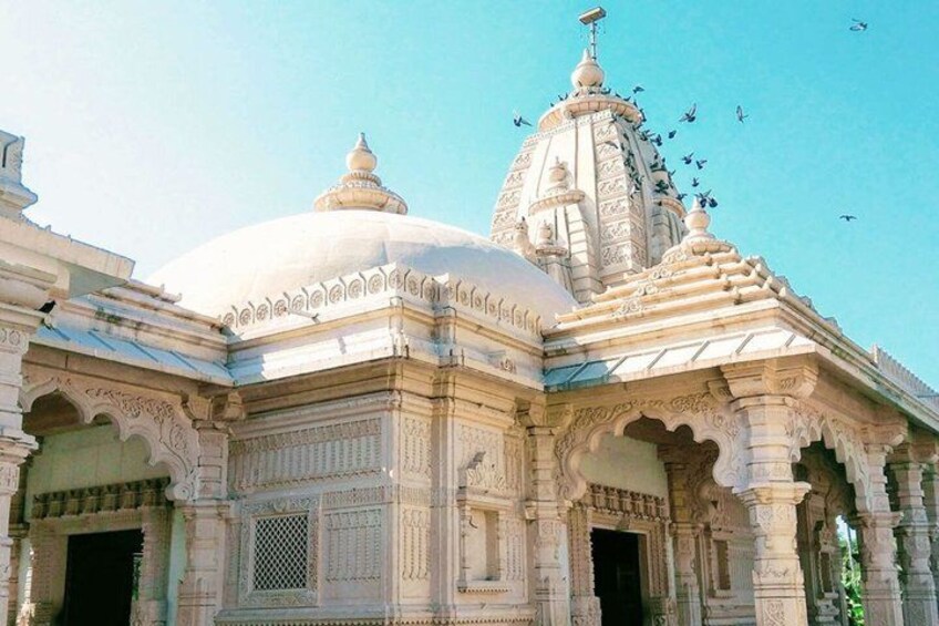 A temple with intricate carvings and a large dome. 3