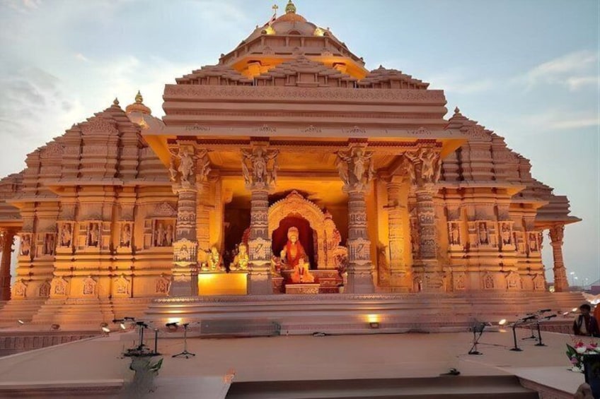 A temple with intricate carvings and a central statue. 3