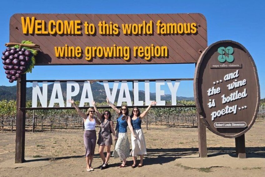 A sign welcoming visitors to Napa Valley with a quote about wine poetry. 2