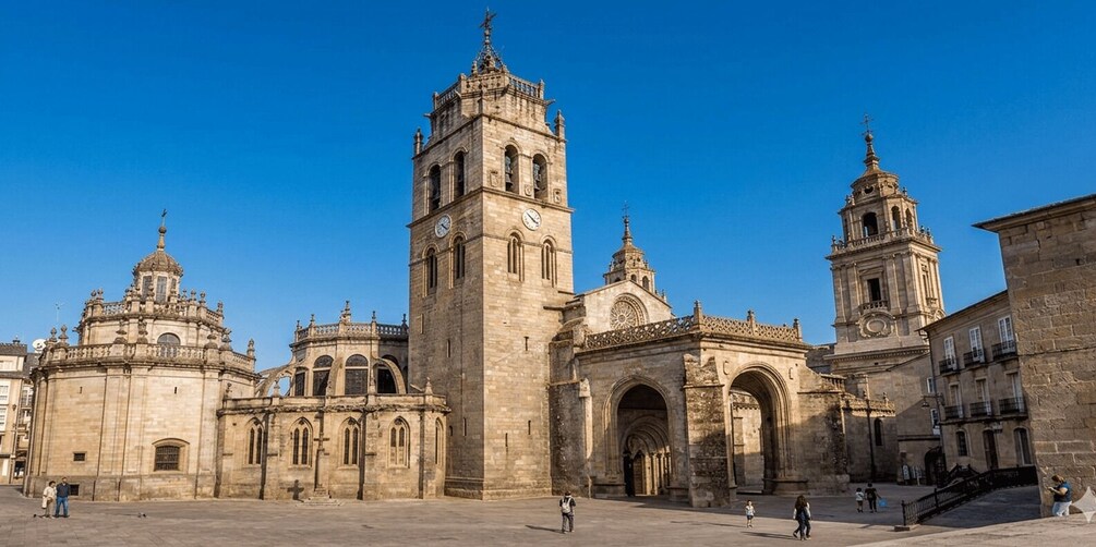 A historic cathedral with two prominent towers and a large central dome. 2