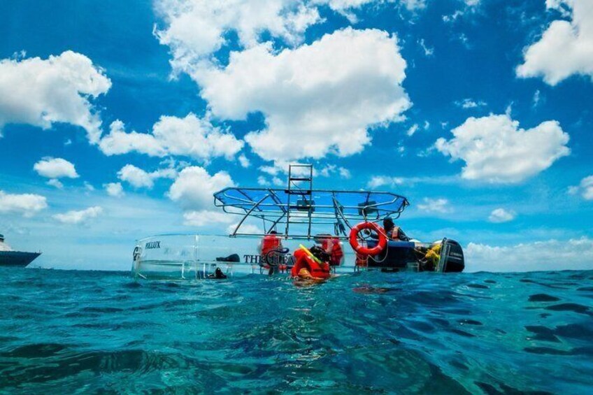 A boat named 'BALIX' with a ladder and life rings on the water. 2