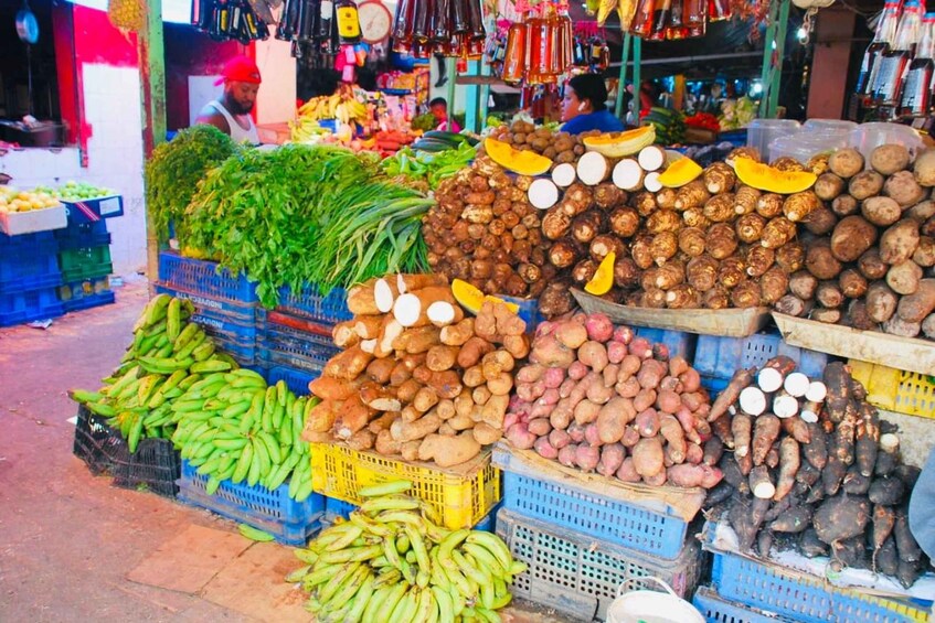 A market with various vegetables and fruits displayed in crates. 3