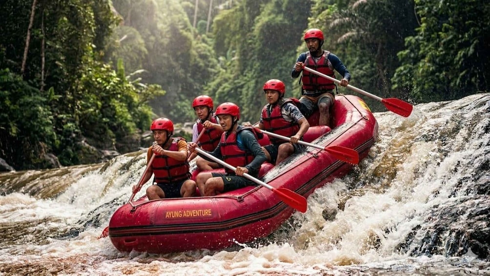 A group of people in a red inflatable raft navigating a river surrounded by lush greenery. 1