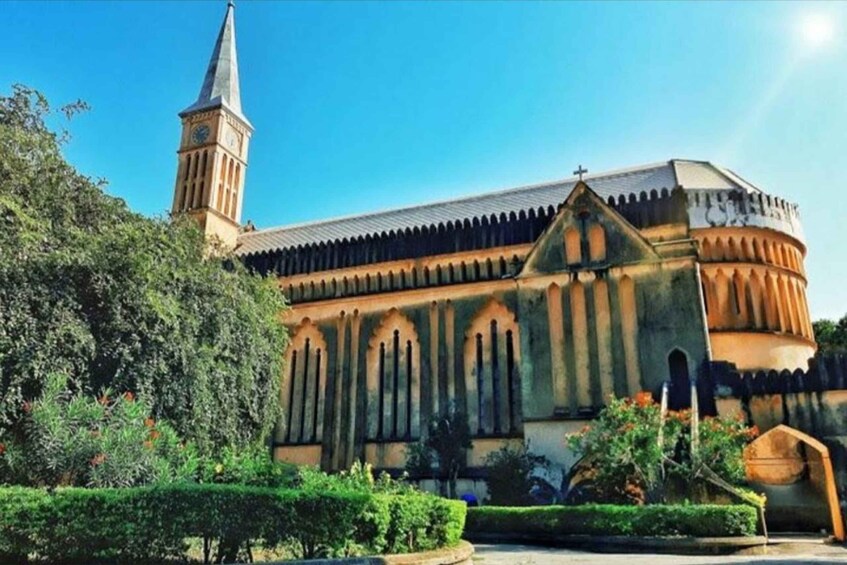 A historic church with a tall tower and arched windows. 4