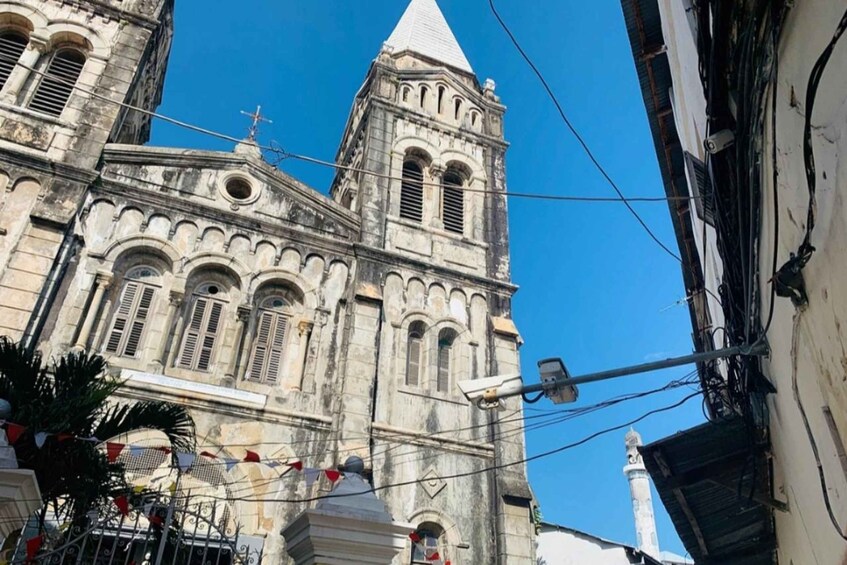 A historic church with a tall bell tower and a dome. 5