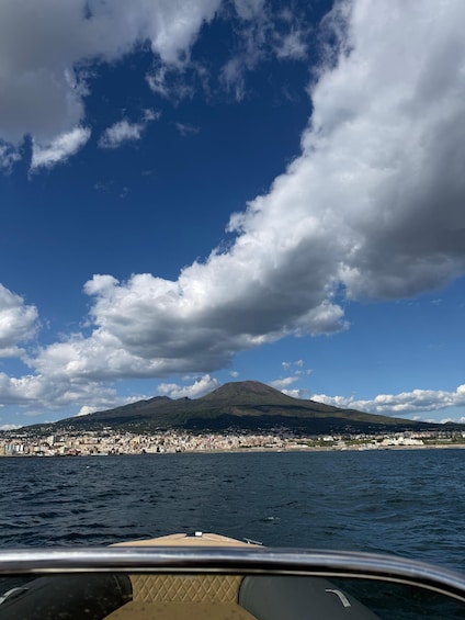 A coastal cityscape with a mountain in the background. 5