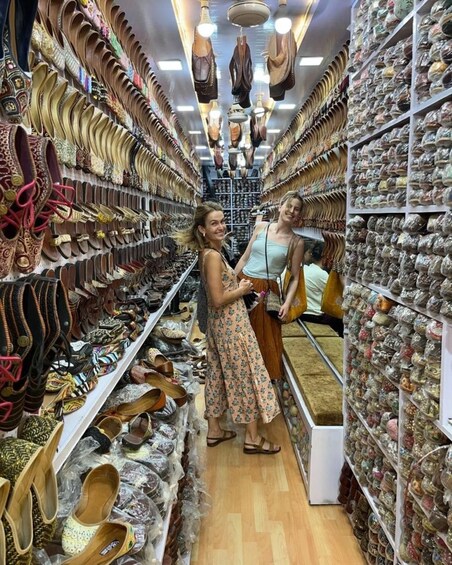 A shoe store with various types of footwear displayed on shelves. 5