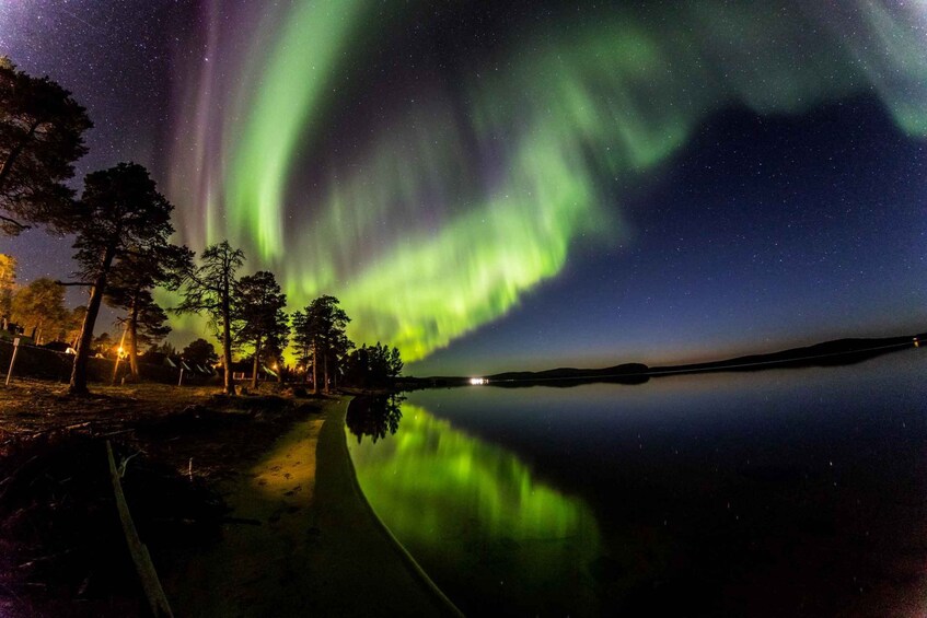 The Northern Lights over a calm lake at night. 3