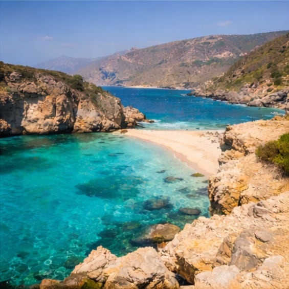 A coastal landscape with clear turquoise waters, rocky terrain, and distant mountains. 5