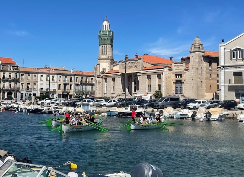 A marina with boats and a clock tower. 3