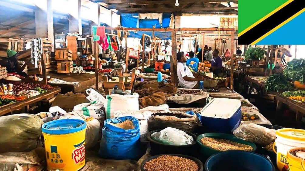 A bustling market with various stalls selling fruits, vegetables, and grains. 4