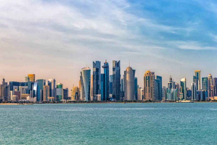 A city skyline with modern skyscrapers along a waterfront. 3