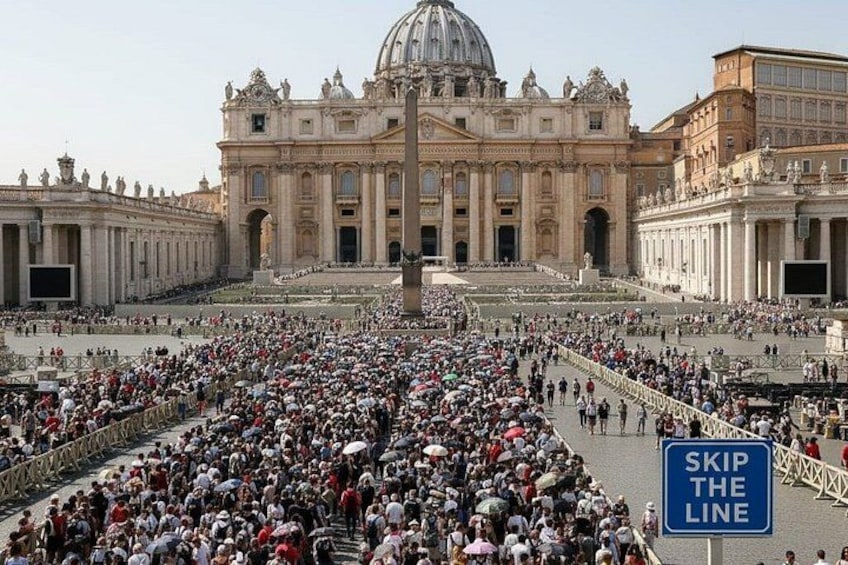 A large crowd of people at a famous historical site with a prominent dome and columns. 1
