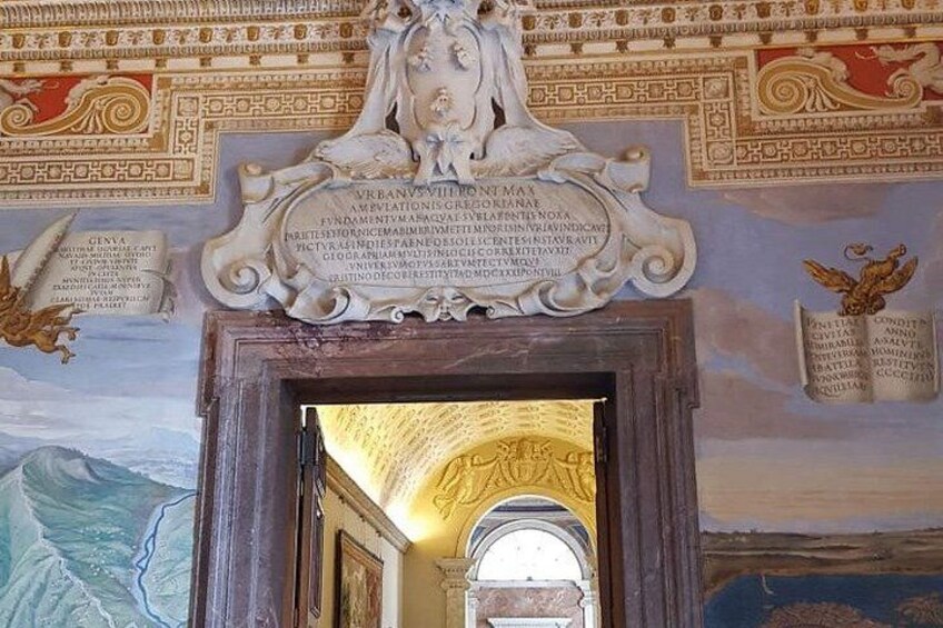 An ornate ceiling with intricate designs and inscriptions. 3