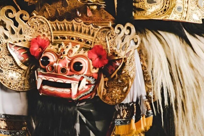 A traditional mask with intricate designs and a crown. 5