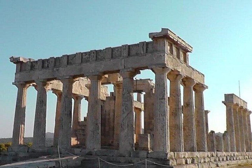 Ancient ruins with columns and a partially intact structure. 5
