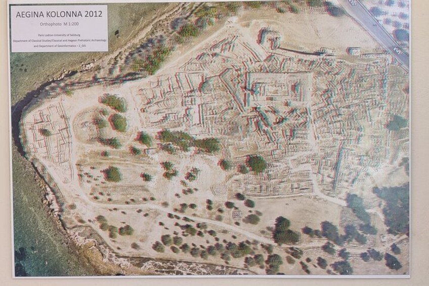 An orthophoto of Aegina Kolonna 2012, featuring a detailed layout of the ancient city with visible ruins and pathways. 1