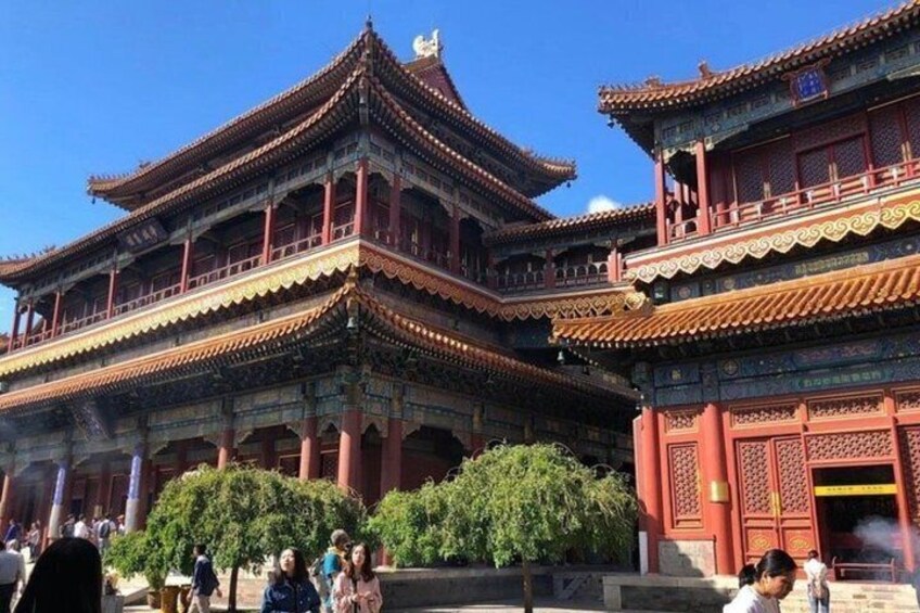Traditional Chinese architecture with multi-tiered roofs and ornate decorations. 1