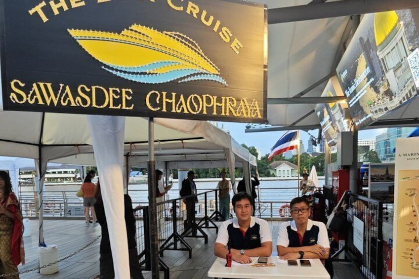 A restaurant named 'The Cruise Savasdee Chaophraam' with a sign featuring a stylized ship and waves. 3