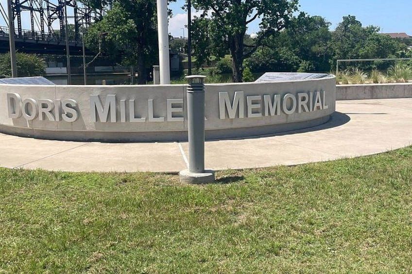 A circular memorial with the name 'Doris Mille Memorial' engraved on it. 4
