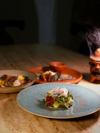 A table with three dishes, one with a blue plate. 5